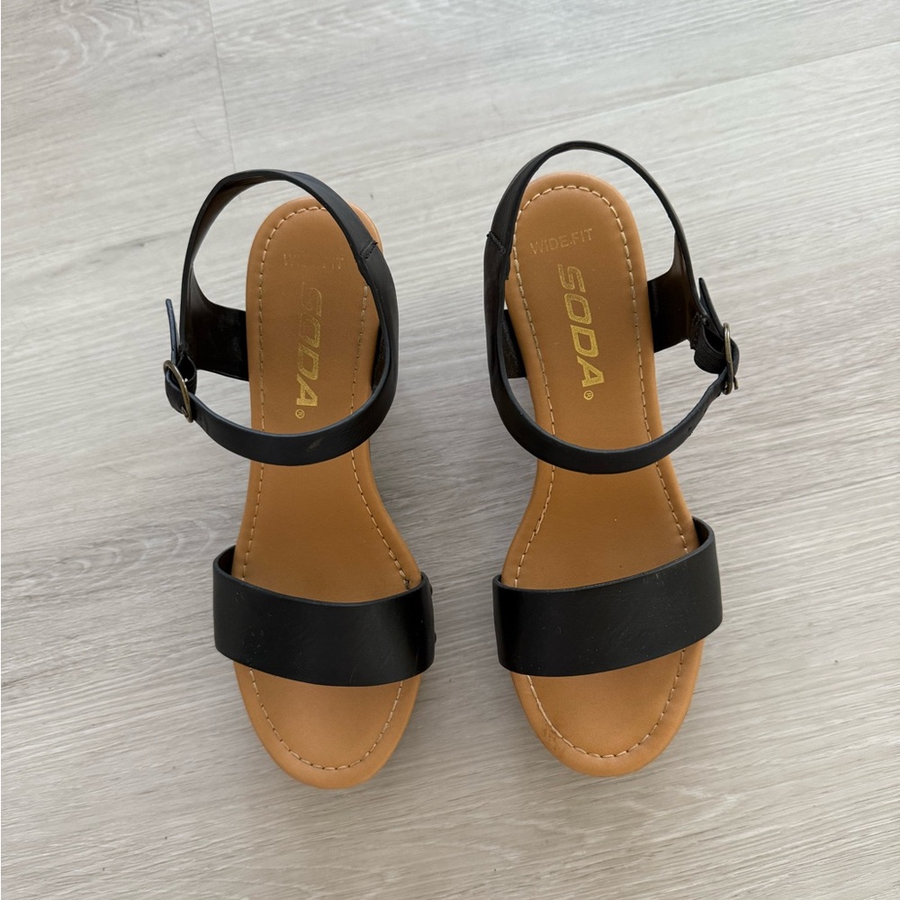 A stylish black sandals with straps